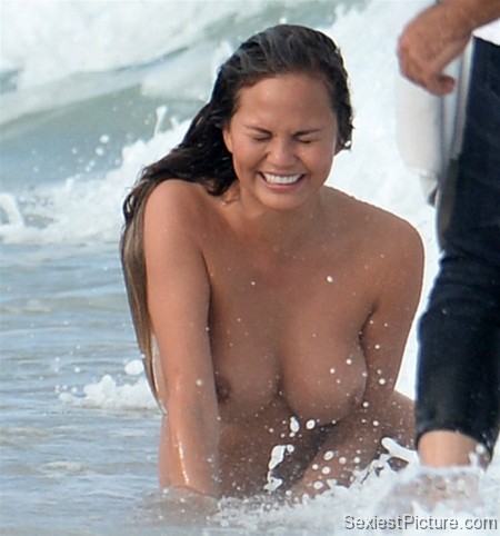 Chrissy Teigen nude naked boobs big tits swimming paparazzi