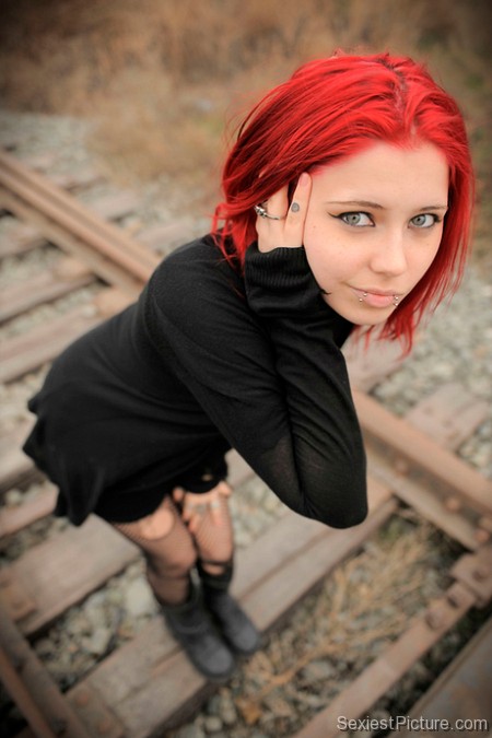 Sexy punk babe red hair piercings tattoo fishnet goth