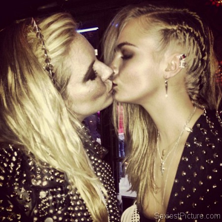 Sienna Miller and Cara Delevingne kissing